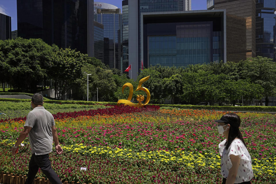 An installation is displayed to celebrate the 25th anniversary of Hong Kong handover to China, in Hong Kong, Thursday, June 23, 2022. As the former British colony marks the 25th anniversary of its return to China, reeling from pandemic curbs that devastated business and a crackdown on its pro-democracy movement, Hong Kong leaders say it is time to transform again and become a tech center that relies more on ties with nearby Chinese factory cities than on global trade. (AP Photo/Kin Cheung)