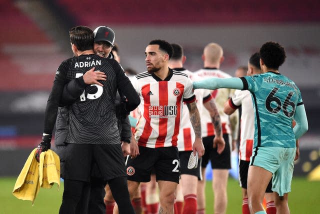 Liverpool manager Jurgen Klopp celebrates with goalkeeper Adrian 