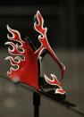 This Feb. 11, 2013 photo shows a red and white patent leather flame Prada sandal displayed at the "Shoe Obsession" exhibit at The Museum at the Fashion Institute of Technology Museum in New York. The exhibition, showing off 153 specimens, runs through April 13. (AP Photo/Kathy Willens)