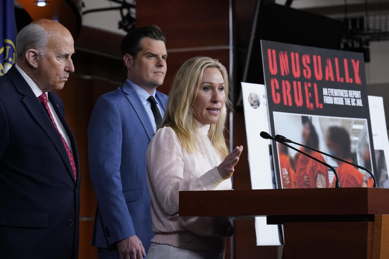 FILE - Rep. Marjorie Taylor Greene, R-Ga., joined at left by Rep. Louie Gohmert, R-Texas, and Rep. Matt Gaetz, R-Fla., speaks at a news conference about the treatment of people being held in the District of Columbia jail who are charged with crimes in the Jan. 6 insurrection, at the Capitol in Washington, Dec. 7, 2021. (AP Photo/J. Scott Applewhite, File)