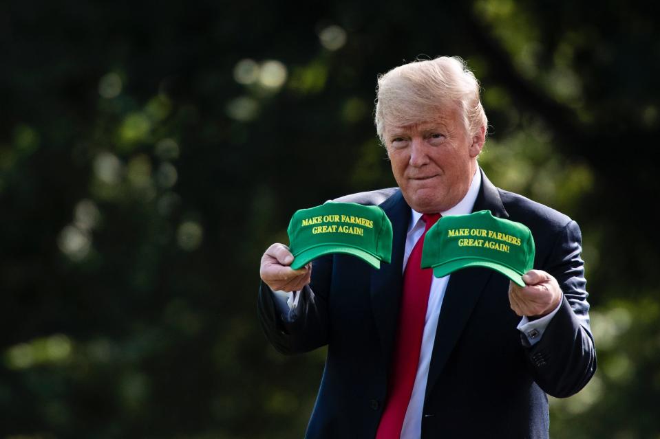 President Donald J. Trump, carrying 'MAKE OUR FARMERS GREAT AGAIN!' hats, walks from the Oval Office to board the Marine One helicopter as he departs from the South Lawn of the White House on Thursday, Aug 30, 2018 in Washington, DC. (Photo: Jabin Botsford/The Washington Post via Getty Images)