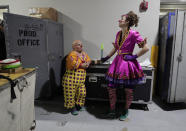 <p>Clowns Gabor Hrisafis, left, and Beth Walters talk in a hallway of the Dunkin Donuts center before a performance, Thursday, May 4, 2017, in Providence, R.I. “The Greatest Show on Earth” is about to put on its last show on earth. For the performers who travel with the Ringling Bros. and Barnum & Bailey Circus, its demise means the end of a unique way of life for hundreds of performers and crew members. (Photo: Julie Jacobson/AP) </p>