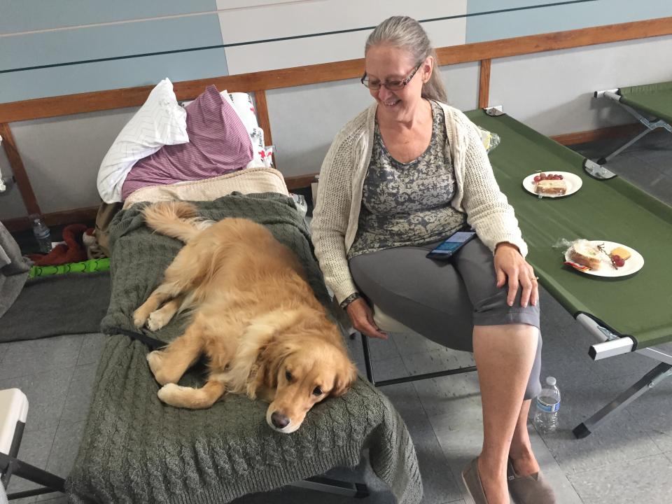 Gry McFarland and her dog at the Santa Rosa Fairgrounds shelter. (Photo: David Knowles)