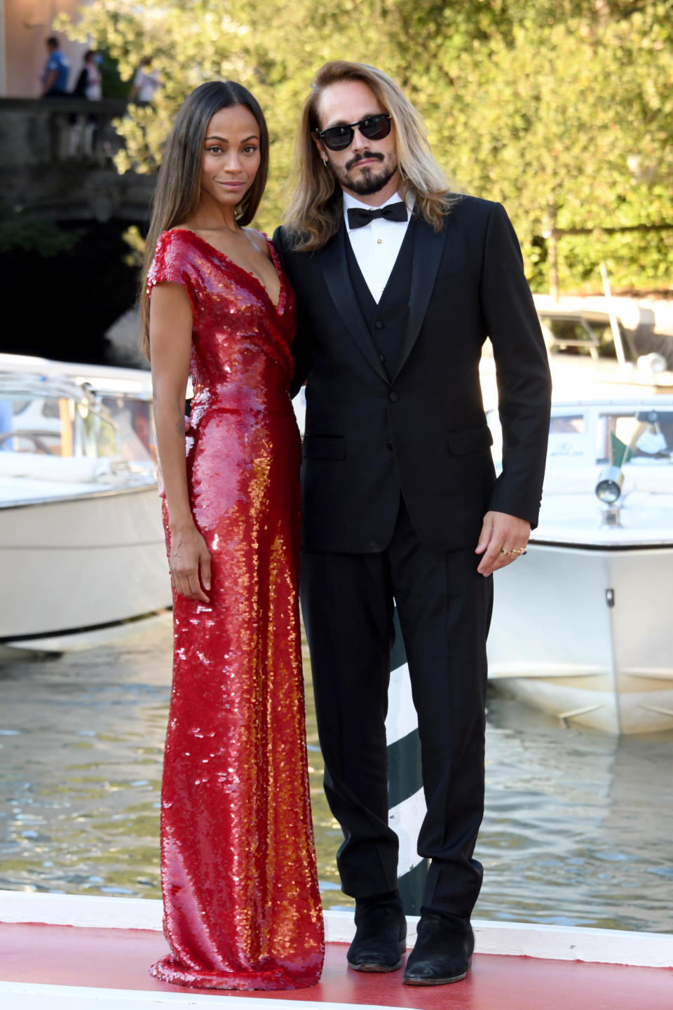 Zoe Saldana Takes a Risk in a High-Slit Red Sequined Dress and 5-Inch Heels  at Venice Film Festival