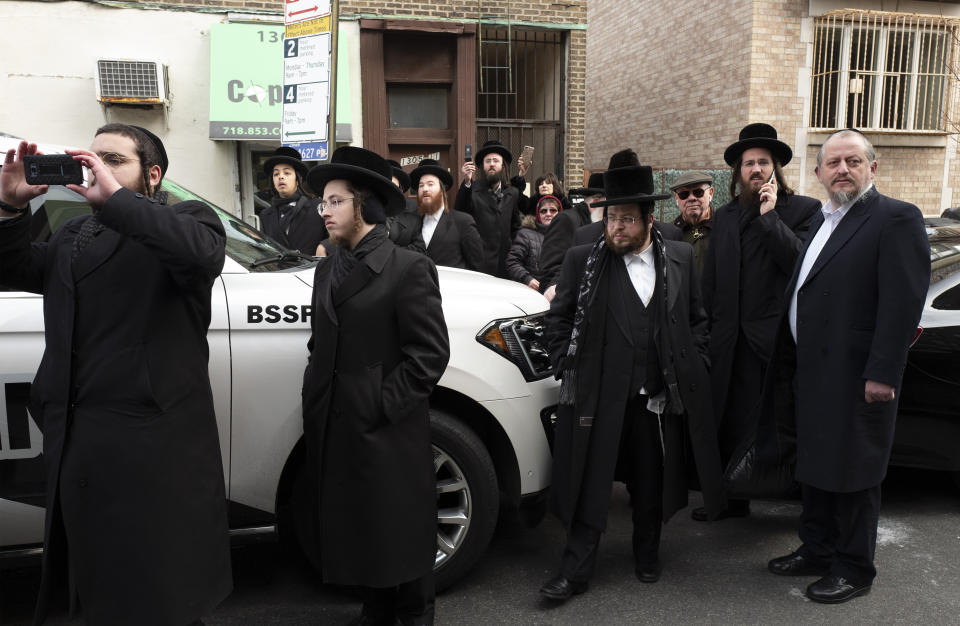 Members of the Borough Park community watch for U.S. Attorney William Barr as he leaves a meeting with Jewish leaders at the Boro Park Jewish Community Council, on Jan. 28 in New York. Jewish communities in the New York City metro area have been on edge after a shooting rampage at a northern New Jersey market in December and an attack at a Hanukah celebration in Monsey, N.Y. that left five people wounded. (Photo: ASSOCIATED PRESS)