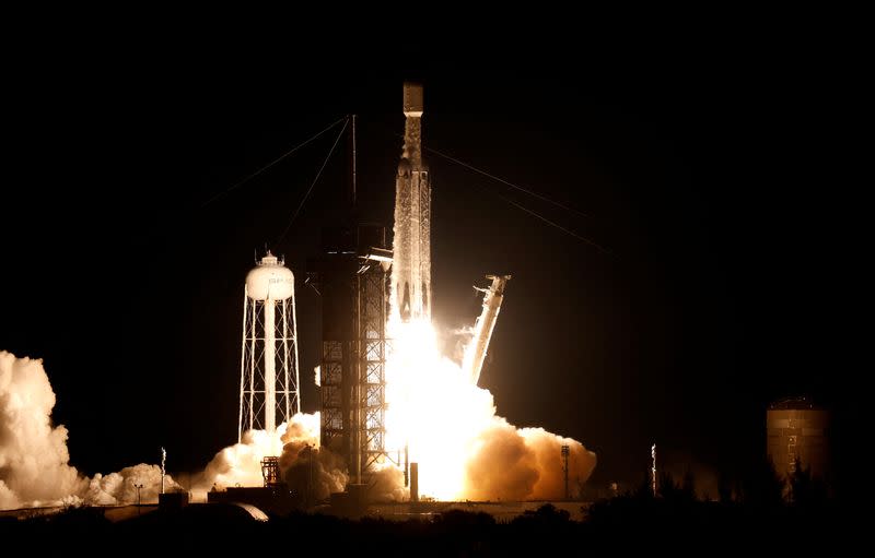 The U.S. military's secretive X-37B robot spaceplane lifts off atop a SpaceX Falcon Heavy rocket