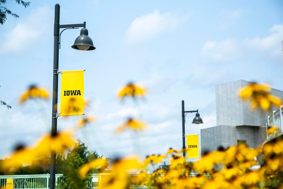 University of Iowa banners hang from light poles, Wednesday, Aug. 11, 2021, in Iowa City, Iowa.