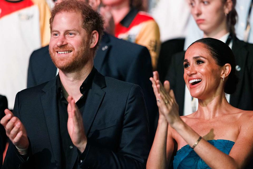 <p>Joshua Sammer/Getty</p> Prince Harry and Meghan Markle at the closing ceremony of the 2023 Invictus Games in Düsseldorf, Germany 