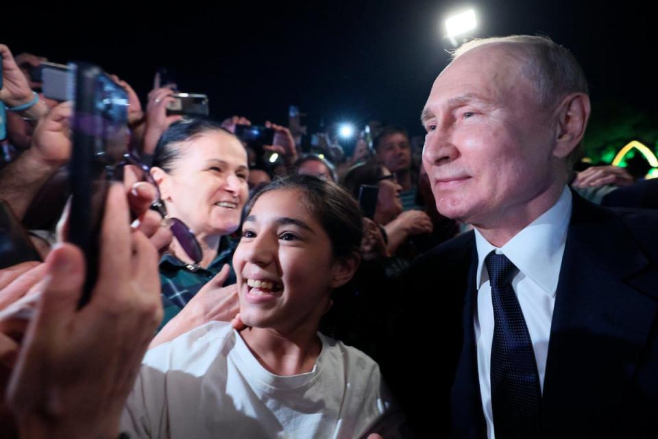 Putin’s selfies with adoring fans attracted speculation he was using a body double (Sputnik)