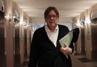 Chair of the Brexit Steering Group Guy Verhofstadt walks in the corridor of the European Parliament in Brussels, prior to a meeting of the Committee on Constitutional Affairs, Tuesday, Oct. 8, 2019. (AP Photo/Virginia Mayo)