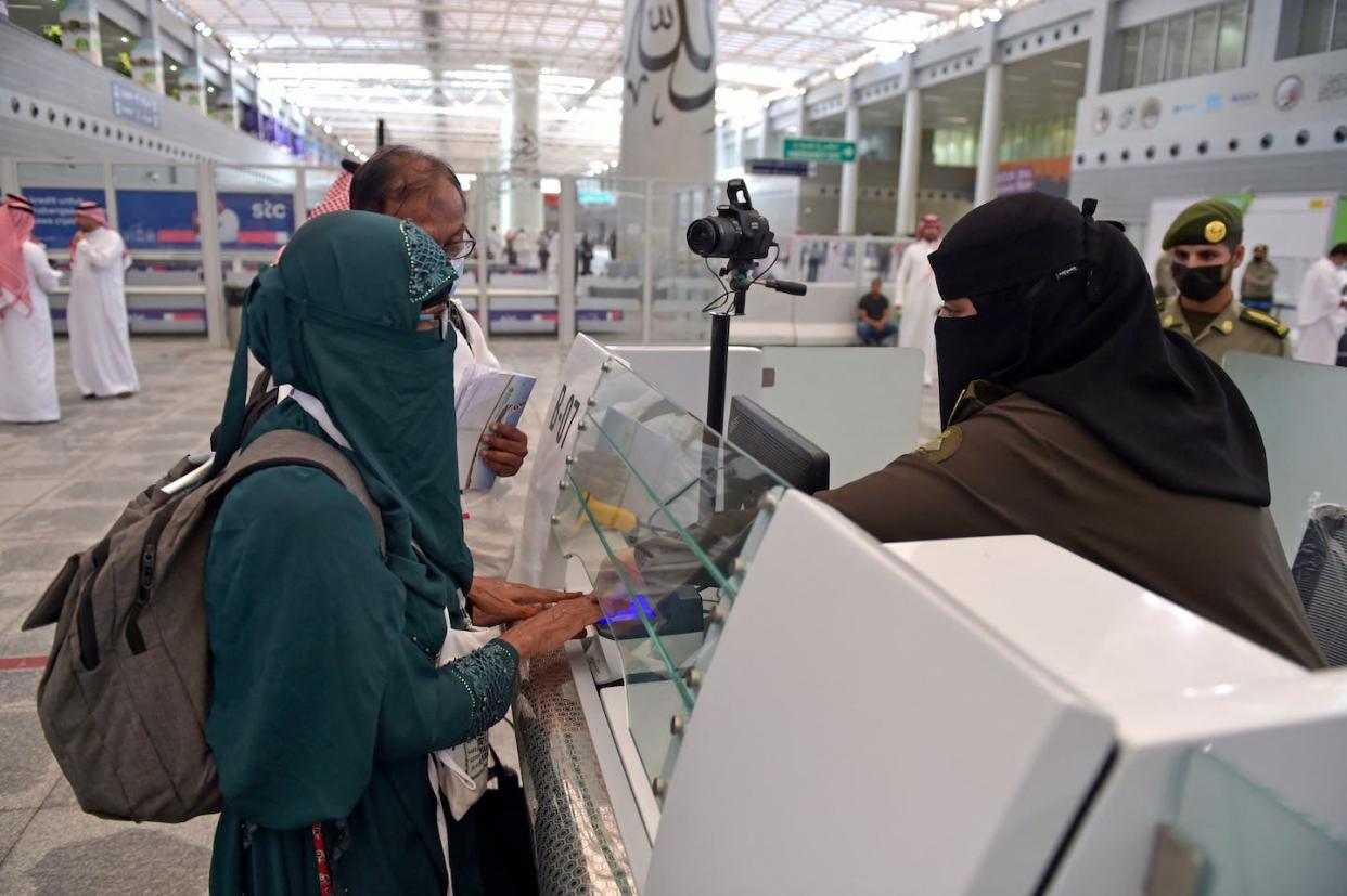 Muslim pilgrims go through passport control in Jeddah, Saudi Arabia, on June 5, 2022, prior to the annual Hajj pilgrimage in the holy city of Mecca. <a href="https://www.gettyimages.com/detail/news-photo/muslim-pilgrims-go-through-passport-control-upon-their-news-photo/1241119045" rel="nofollow noopener" target="_blank" data-ylk="slk:Amer Hilabi/AFP via Getty Images;elm:context_link;itc:0;sec:content-canvas" class="link ">Amer Hilabi/AFP via Getty Images</a>