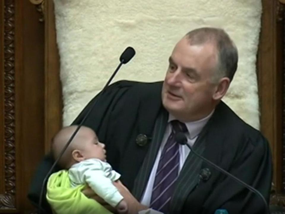 New Zealand speaker of the house Trevor Mallard holding the baby: BBC