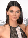 <p>At the Nokia Theatre in Los Angeles, Jenner’s slick straight brunette hair was a mod frame for her silver eyeliner and pale pink lipstick. <i>(Photo: Getty Images)</i></p>