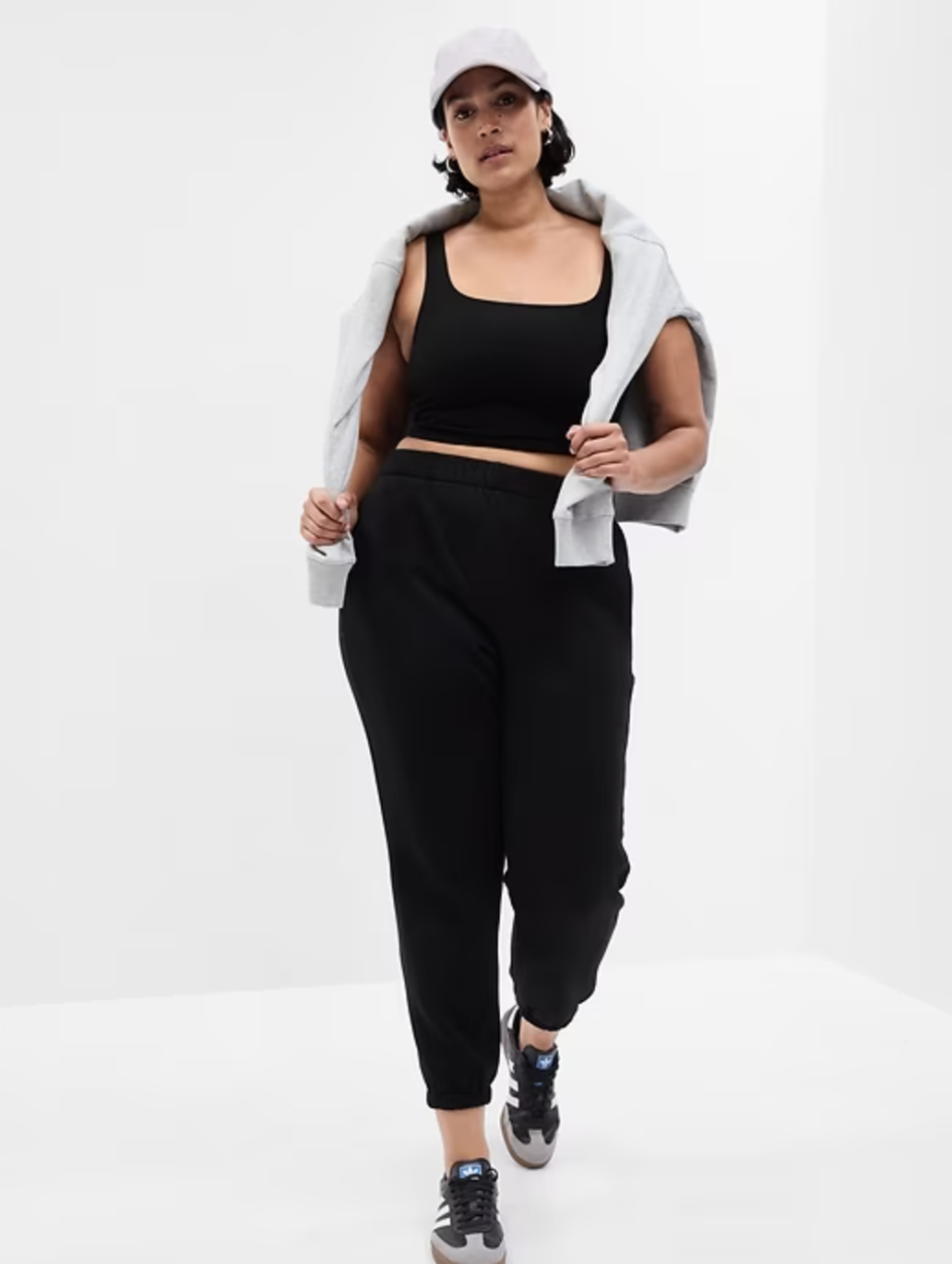 model wearing black high-rise joggers with matching crop top