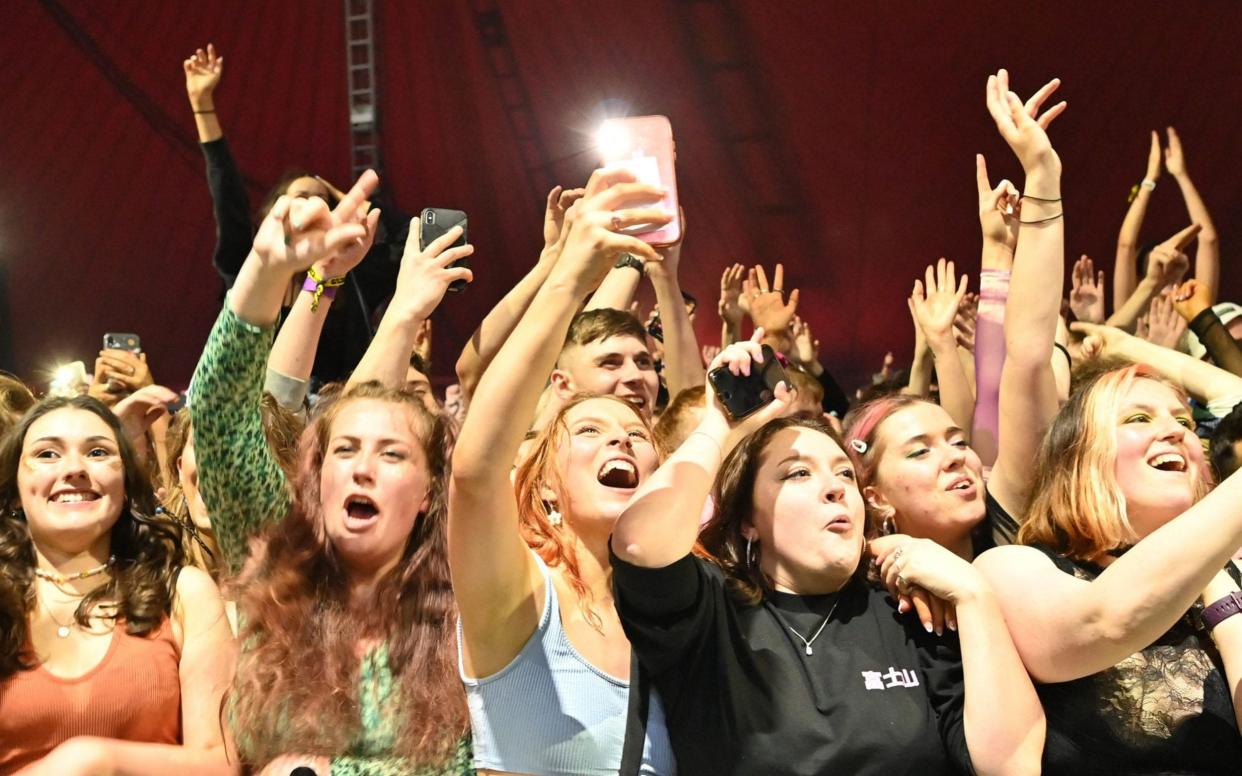 Fans watching the band Blossom perform at a pilot event in Liverpool in May - AFP