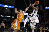 Vanderbilt guard Tyrin Lawrence shoots over Tennessee guard Tyreke Key (4) during the second half of an NCAA college basketball game Wednesday, Feb. 8, 2023, in Nashville, Tenn. (AP Photo/Wade Payne)