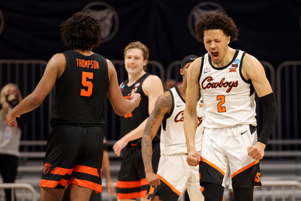 Cade Cunningham yells and flexes in reaction to a shot. 