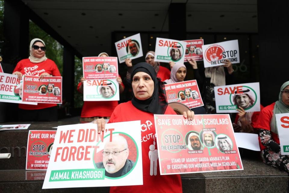 Protestors in front of Saudi Consulate in New York holding pictures of Jamal Khashoggi. Source: Getty Images