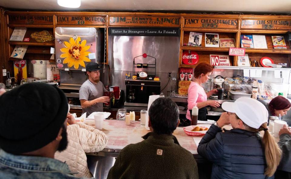 Jim-Dennys Diner’s manager Leilani Naylor, right, and employee Chris Beirn, left, work the lunch rush on Thursday, Jan. 9, 2020, ahead of the announced closing of the downtown Sacramento landmark restaurant.