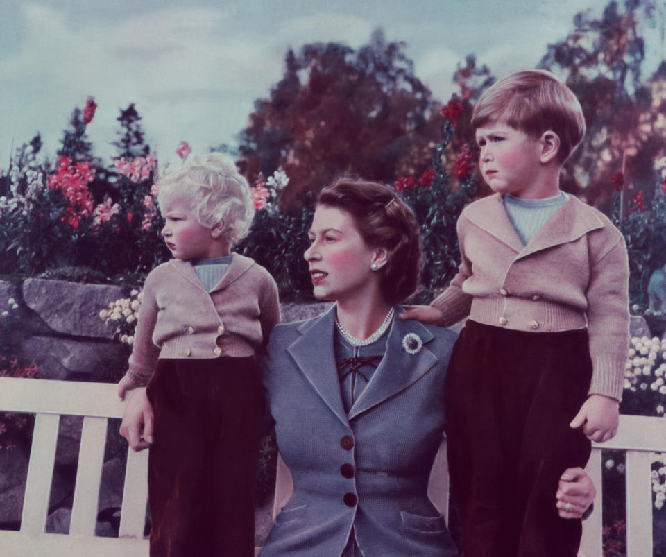 Queen Elizabeth II with her children Charles and Anne at Balmoral, 1952. (Photo by © Hulton-Deutsch Collection/CORBIS/Corbis via Getty Images)