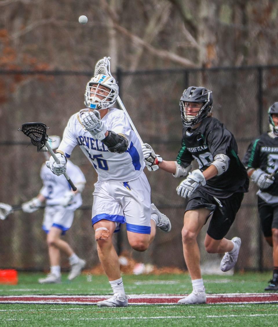 Norwell's Austin Shea controls the ball during a game against Marshfield at Falmouth High on Tuesday, April 19, 2022.