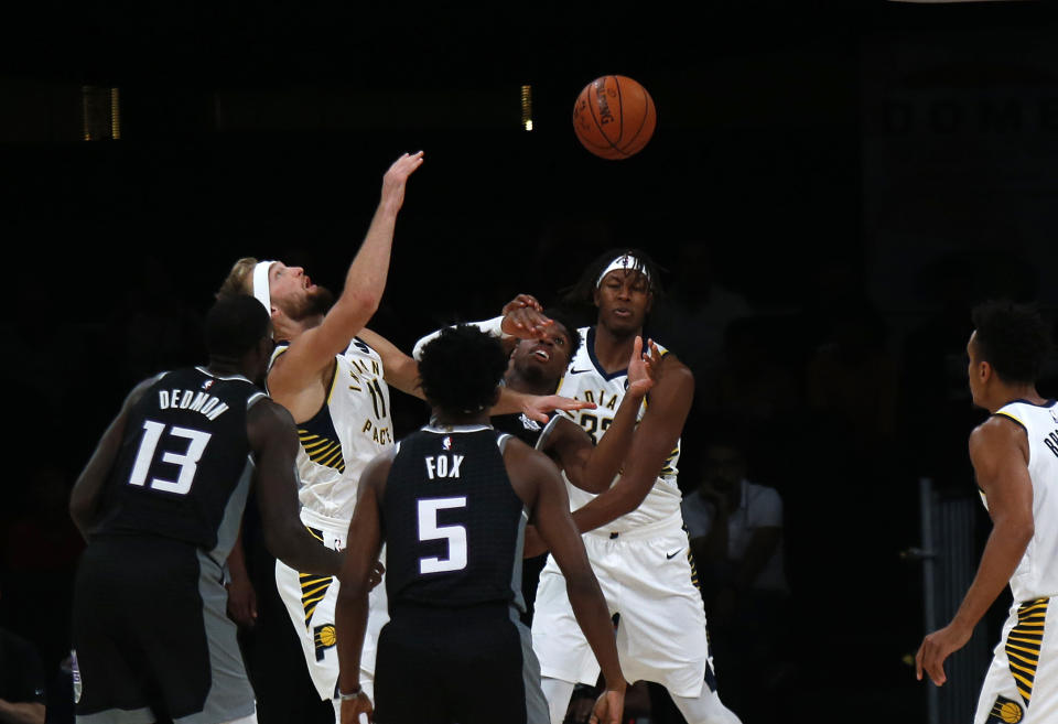 Players from Sacramento Kings, in blue, and Indiana Pacers vie for the ball during the NBA India Games 2019, in Mumbai, India, Saturday, Oct. 5, 2019. (AP Photo/Rajanish Kakade)