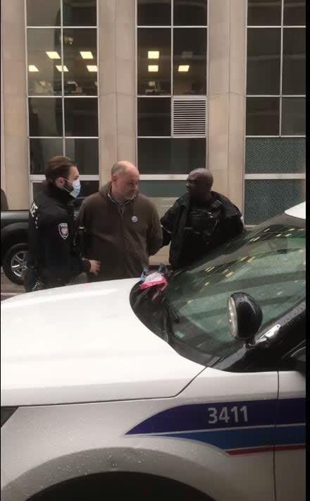 Chris Barber, one of the organizers of the Freedom Convoy, is seen arrested by Ottawa police officers in downtown Ottawa on Feb. 17, 2022.