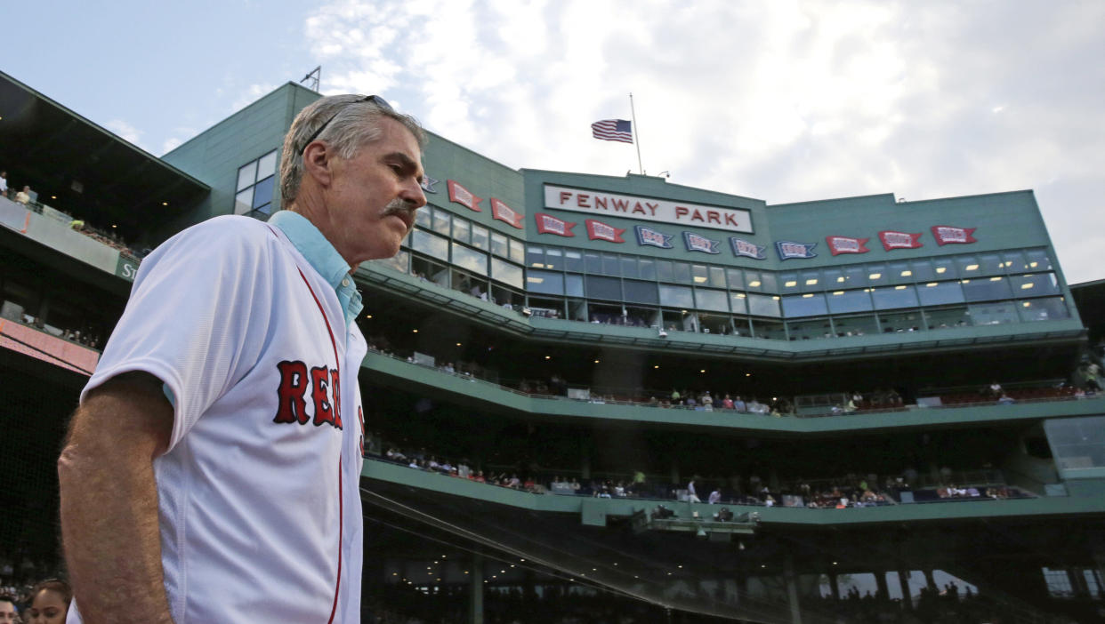 Former Boston Red Sox first baseman Bill Buckner is introduced while honored with his 1986 teammates, who won the American League championship thirty years ago, prior to the Red Sox's baseball game against the Colorado Rockies in Boston, Wednesday, May 25, 2016. (AP Photo/Charles Krupa)