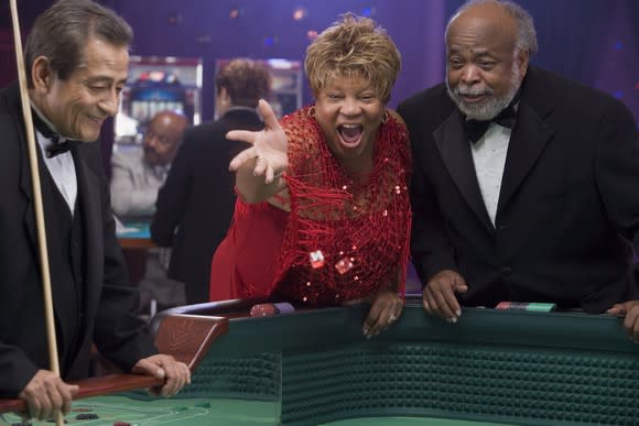 Older couple playing craps at casino