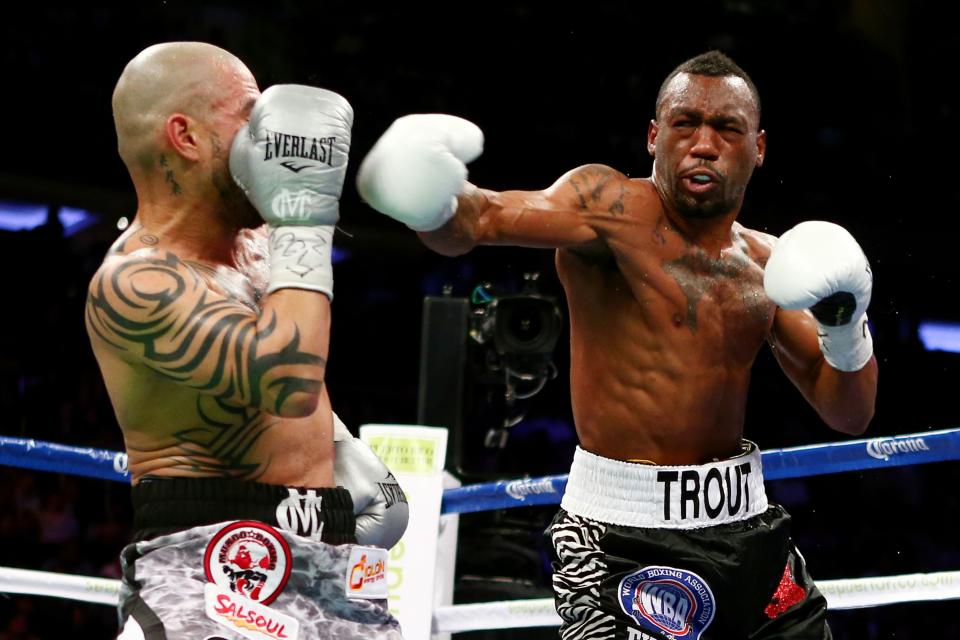 NEW YORK, NY - DECEMBER 01: Austin Trout (R) throws a punch against Miguel Cotto in their WBA Super Welterweight Championship title fight at Madison Square Garden on December 1, 2012 in New York City. (Photo by Elsa/Getty Images)