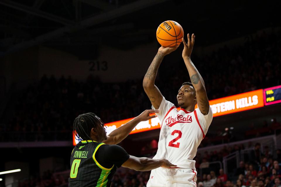 Cincinnati Bearcats guard Landers Nolley II (2) shoots the ball for three during the first half of an NCAA men’s college basketball game on Saturday, Feb. 11, 2023 at Fifth Third Arena in Cincinnati.  