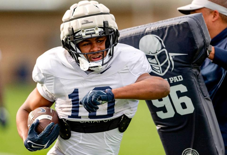 Penn State running back Nick Singleton runs a drill during practice on Tuesday, April 11, 2023.