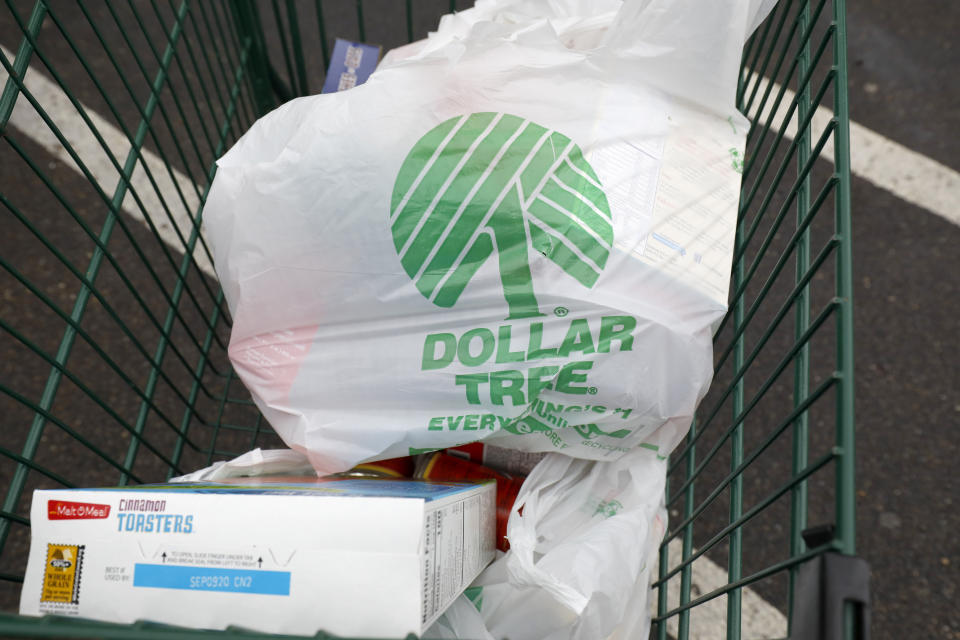 Shopping bags rest in a shopping cart from a Richland, Miss., Dollar Tree store on Tuesday, Nov. 26, 2019. (AP Photo/Rogelio V. Solis)