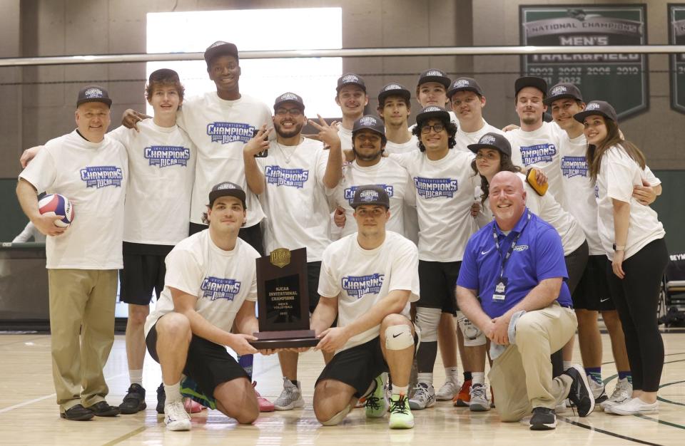 The Finger Lakes Community College men's volleyball team celebrates its National Invitational Championship.