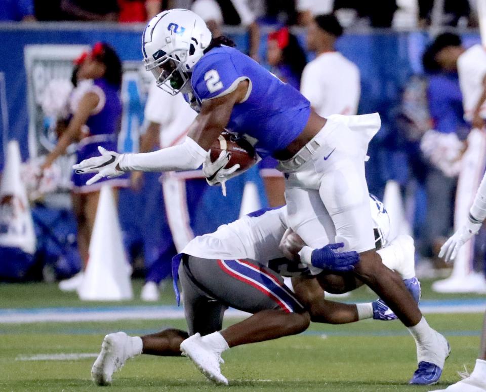 MTSU wide receiver Izaiah Gathings (2) runs the ball as TSU cornerback Cory Gross Jr. (24) tries to stop him on Saturday, Sept. 17, 2022, at MTSU’s home opener.<br>31 Mtsu V Tsu Football