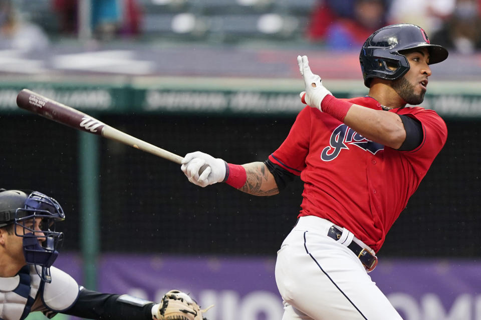 Cleveland Indians' Eddie Rosario watches his RBI-single in the fourth inning of a baseball game against the New York Yankees, Saturday, April 24, 2021, in Cleveland. (AP Photo/Tony Dejak)