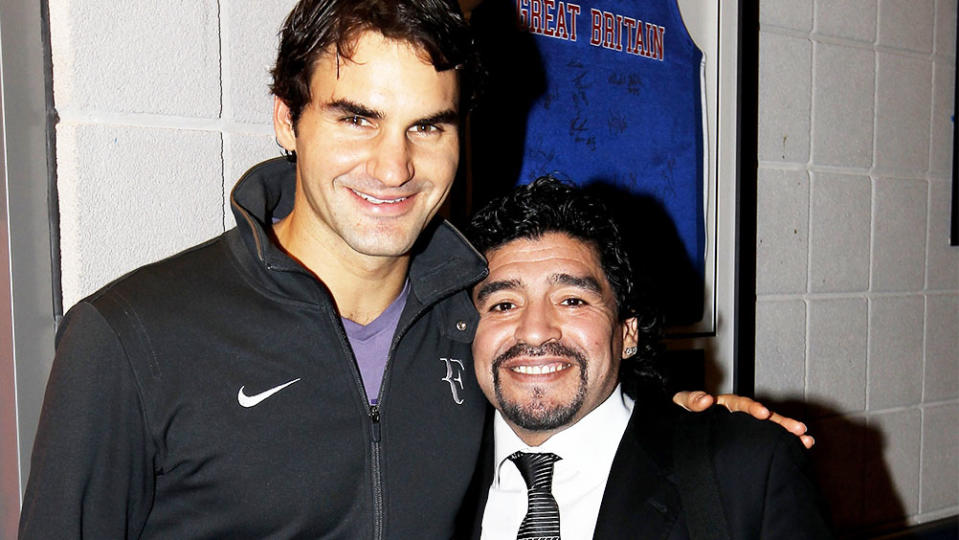 Roger Federer (pictured left) and the late Diego Maradona (pictured right) pose for a photo.