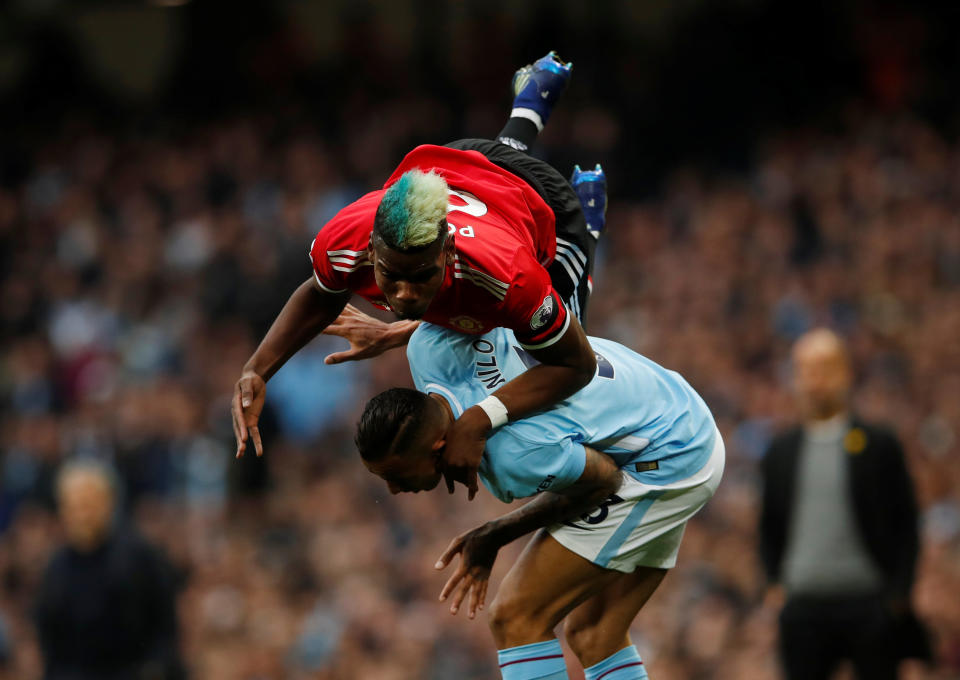 <p>Manchester United’s Paul Pogba goes over the top of Manchester City’s Danilo </p>