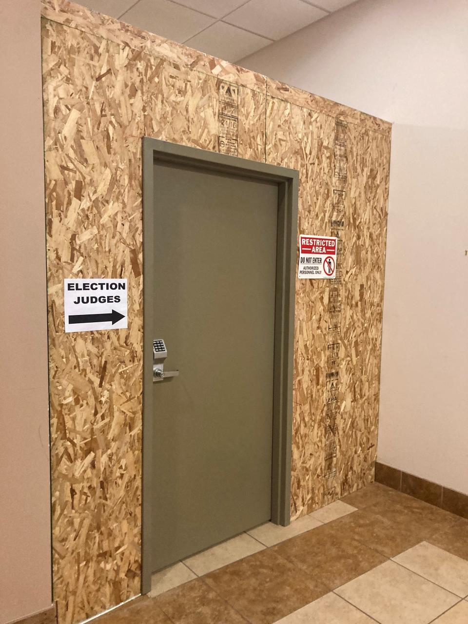 A secure door with locked keypad access has been constructed in front of the community room at Pueblo Police Department headquarters where the upcoming mayoral runoff is being administered on January 5, 2024. Entry to the ballot-counting room is secured with another locked door.