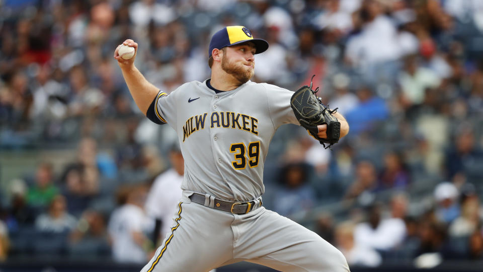 FILE -Milwaukee Brewers starting pitcher Corbin Burnes (39) throws against the New York Yankees during the eight inning of a baseball game, Sunday, Sept.10, 2023, in New York. The Milwaukee Brewers traded All-Star right-hander Corbin Burnes to the Baltimore Orioles on Thursday, Feb. 1, 2024 for left-hander DL Hall, infield prospect Joey Ortiz and a competitive balance draft pick.(AP Photo/Noah K. Murray, File)