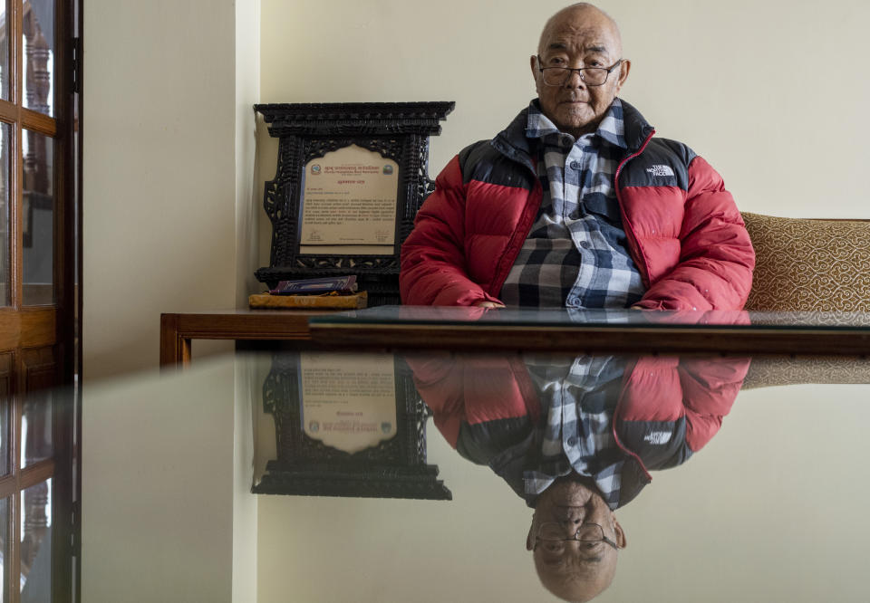 Kanchha Sherpa sits on a chair during an interview with Associated Press at his residence in Kathmandu, Nepal, Saturday, March 2, 2024. Kanchha Sherpa, 91, was among the 35 members in the team that put New Zealander Edmund Hillary and his Sherpa guide Tenzing Norgay atop the 8,849-meter (29,032-foot) peak on May 29, 1953. (AP Photo/Niranjan Shrestha)