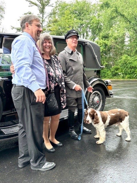 Dave Sutter, left, and his wife, Janice Yordy Sutter, await a ride in a 1931 Packard limousine following their final worship service at Kern Road Mennonite Church. They recently completed their 35 years as pastors at the South Bend church.