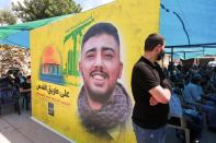 People attend the funeral of Mohamed Kasem Tahan who was killed at the border fence with Israel, yesterday, in Adloun