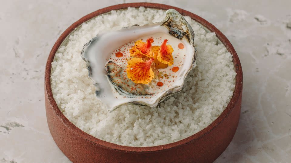 Oyster with smoked cream and sea buckthorn oil with hazelnuts.  - Courtesy of Villa Frantzén Restaurant and Bar