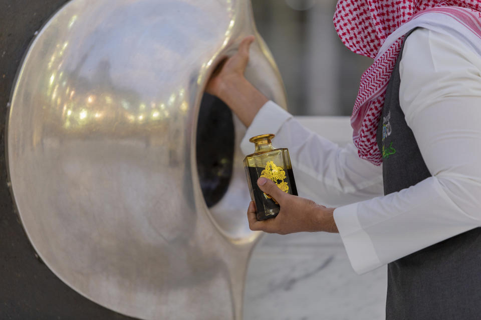 The Black Stone located on the Kaaba's eastern corner is prepared before pilgrims start their circumambulation of the the square structure in the Great Mosque, toward which believers turn when praying, in Mecca, Saudi Arabia, late Monday, July 27, 2020. Anywhere from 1,000 to 10,000 pilgrims will be allowed to perform the annual hajj pilgrimage this year due to the coronavirus pandemic. (Saudi Ministry of Media via AP)