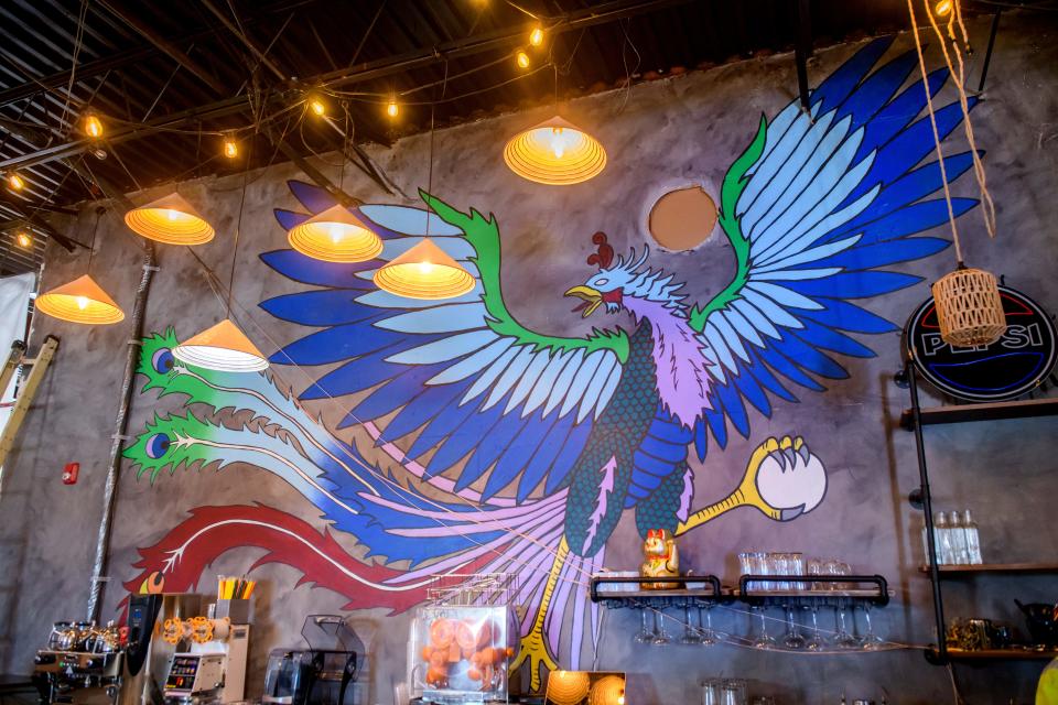 A colorful mural adorns the wall behind the bar where patrons will check in to the new Farmer's Buffet when it opens in East Peoria.