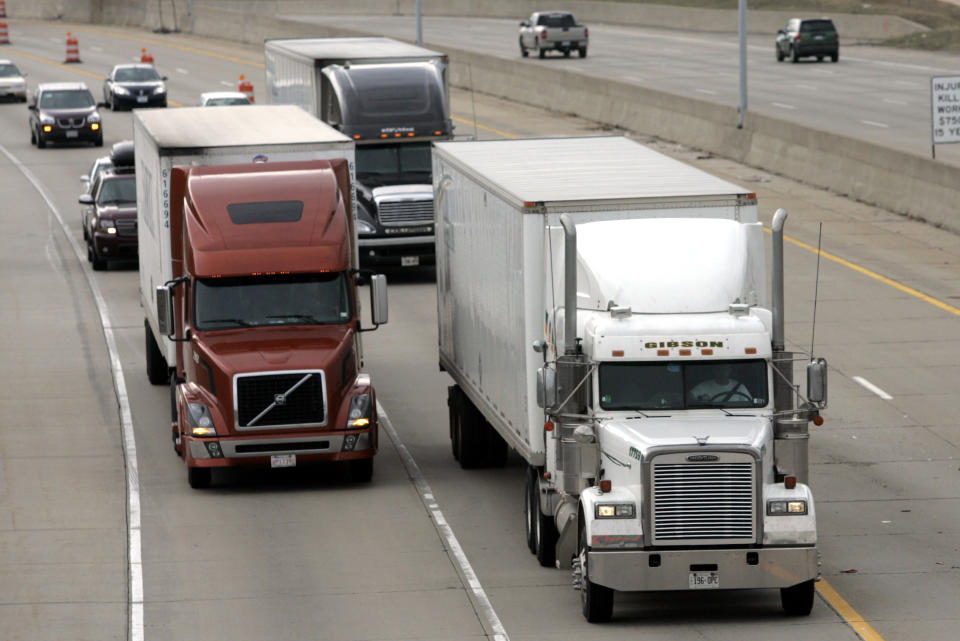 Two freight trucks are driven on the Fisher freeway in Detroit, Michigan (Photo: REUTERS/Rebecca Cook)