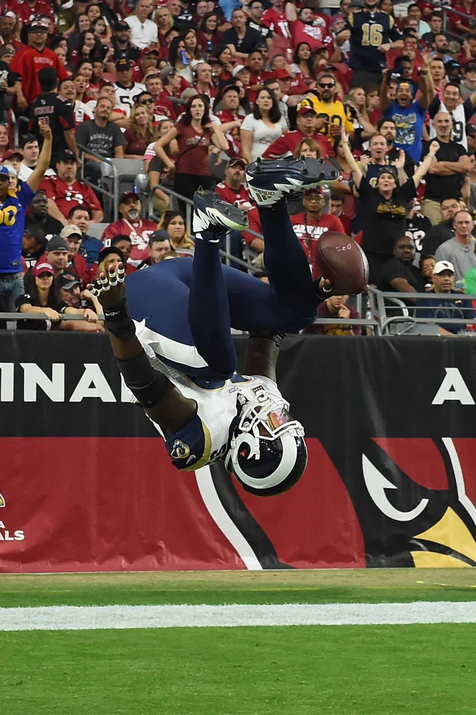 <p>Inside linebacker Alec Ogletree #52 of the Los Angeles Rams flips into the end zone on a 41-yard interception return for a touchdown during the first quarter of the NFL game against the Arizona Cardinals at the University of Phoenix Stadium on December 3, 2017 in Glendale, Arizona. (Photo by Norm Hall/Getty Images) </p>