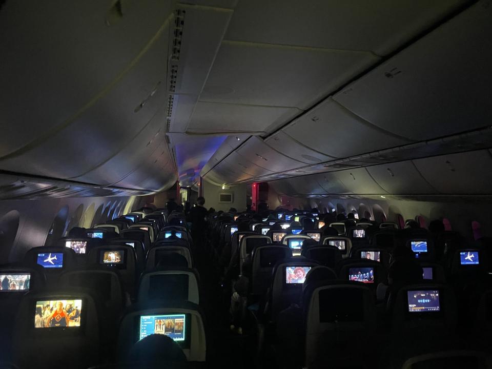 A dark airplane cabin.