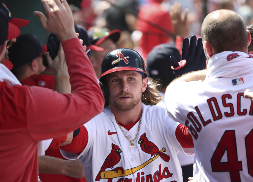 St. Louis Cardinals' Brendan Donovan celebrates with teammates in the dugout after hitting a three-run home run in the sixth inning of a baseball game against the Detroit Tigers, Sunday, May 7, 2023, in St. Louis. (AP Photo/Tom Gannam)